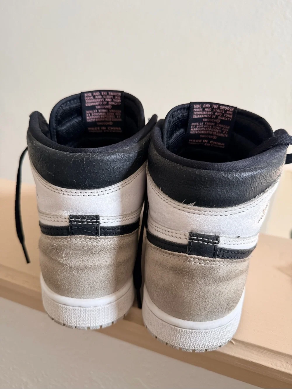 Nike Air Jordan 1 Black and White High-Top Sneakers with Pink Accent